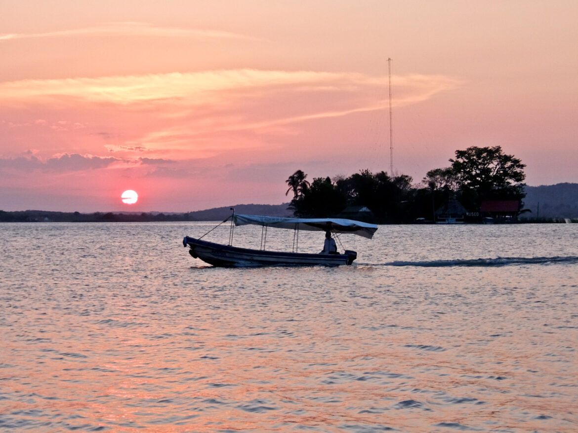 Flores Sunset w boat is one of the best places to visit in Guatemala