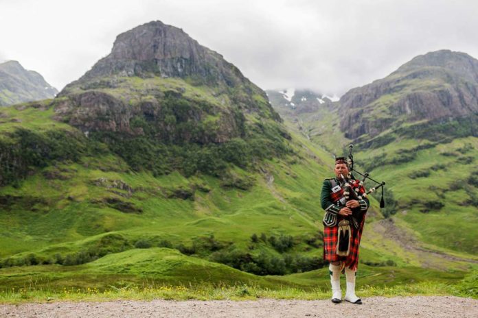 Scottish Bagpiper at Glen Coe, Scotland